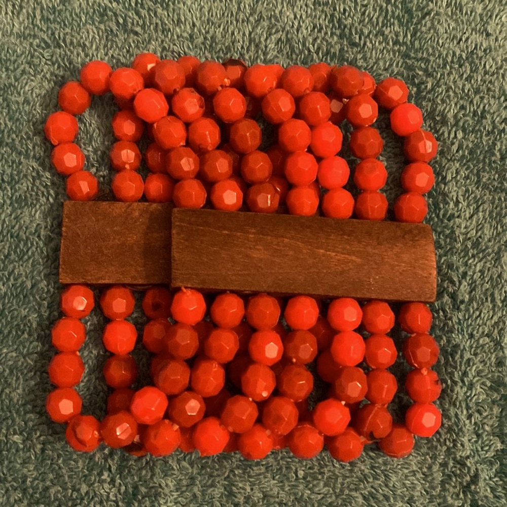 Bracelet plastic 7 row red beaded and wood bracelet